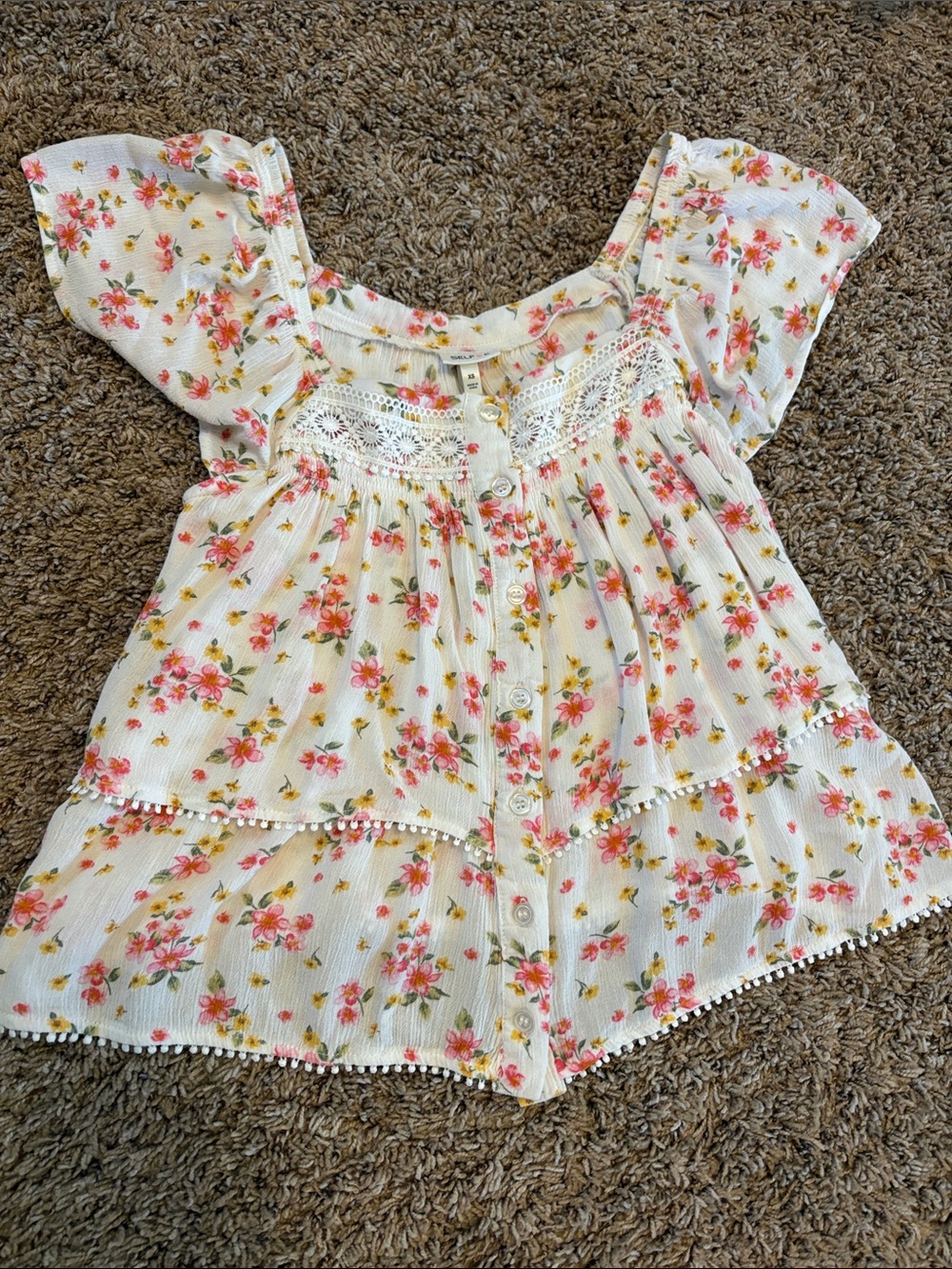 Woman’s flowy floral top with buttons